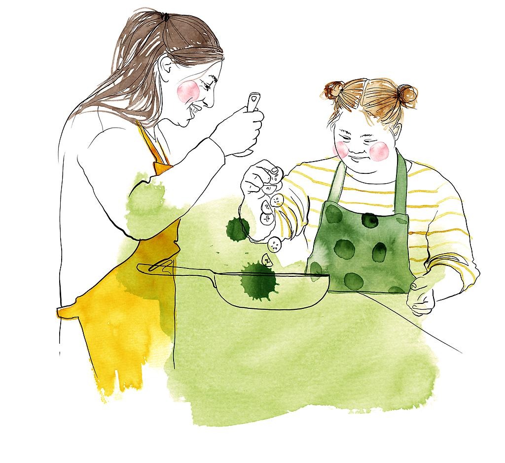 En illustration i gult, orange och grönt på två personer som lagar mat tillsammans