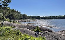 Kort på Vänern och stenblock i Björkkullasand. 